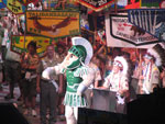 Sparty, MSU's mascot, presents city and state proclamations to the OA at the Opening Show