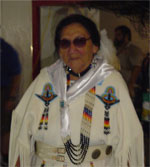 Ms. Rosetta LeClaire offers a prayer at the AIA Pow Wow
